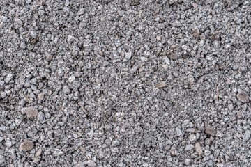 Grauer Schotter als Baumaterial für Straßenbau und Wegebau als Textur