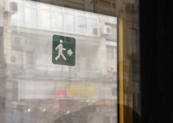 Green exit sign on the bus door