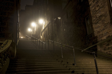 Fototapeta na wymiar Dark, creepy flight of stairs in Edinburgh UK