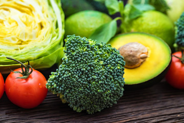 Fresh vegetables, lime and avocado close
