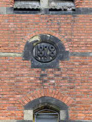 Carved stone in wall recording date