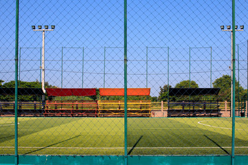 Obraz premium Soccer field with artificial turf in a stadium,Mae-Hia Public's football field ,Chiang Mai Thailand