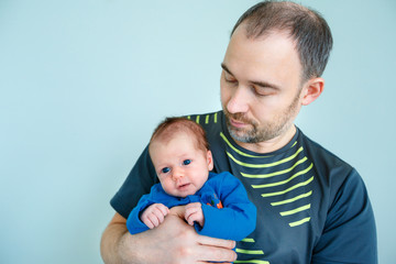 Cute newborn baby girl and her father
