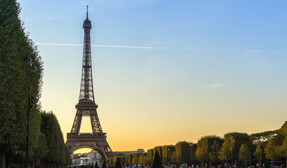 View of the Eiffel Tower at sunset from the Champs de Mars