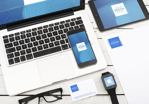 Devices, Laptop, and Stationery on Table Mockup