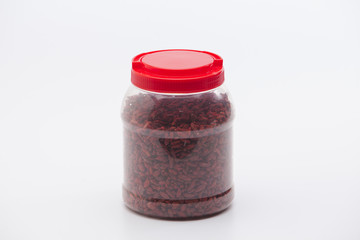  Dried red goji berries in plastic bottle isolated 