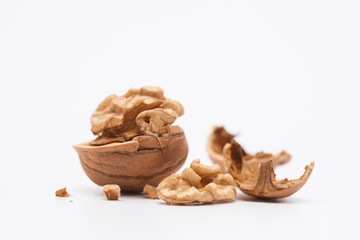 Cracked walnut isolated on the white background
