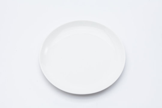  Empty white dinner plate over white background