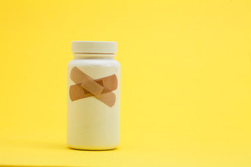 Band with Medicine bottle on the yellow background