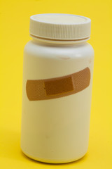 Band with Medicine bottle on the yellow background