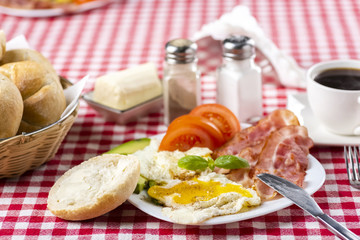 bacon and eggs with avocado and tomato, bread and coffee
