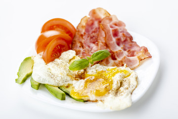 bacon and eggs with avocado and tomato, bread and coffee