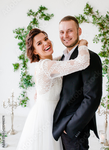 Groom And Bride Posing Smiling In Studio For Wedding Shot Groom And Bride Posing Smiling In Studio For Wedding Shot Day