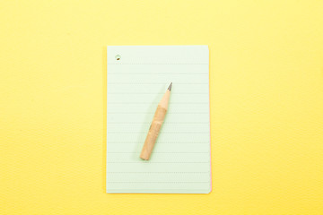 Sheet of paper notes on yellow background