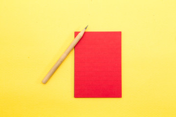 Sheet of paper notes on yellow background