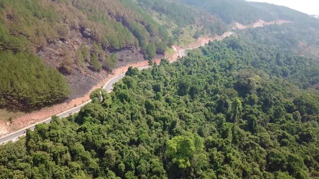 
Top view. Aerial view from drone. Royalty high quality free stock image of road in forest. Road in forest is beautiful with many tree, road on pass very winding and curve