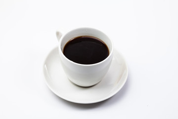 A cup of black coffee on a white