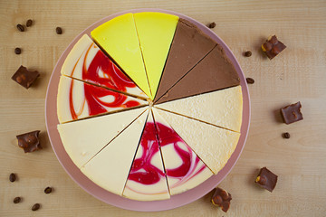 assorted cheesecake on plate on wooden background