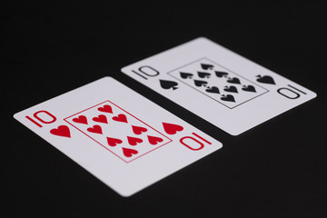 Ten of spades and ten of hearts playing card