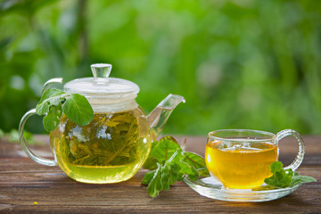 delicious green tea in a beautiful glass bowl on table