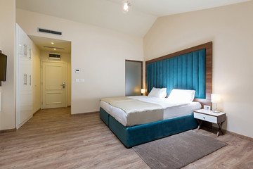 Interior of a double bed hotel bedroom in the morning