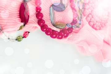 Composition of Fashionable Women's Accessories Jewelry Box gift Red Beads Pink Scarf on a White Background.