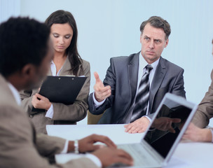 businessman holds working meeting with employees