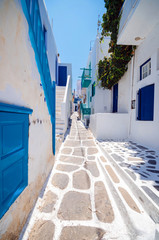 Mykonos, Greece. Whitewashed dotted alley in old city, Greek Islands.