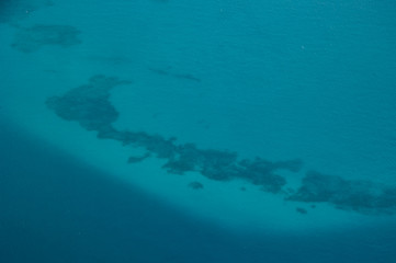 blue ocean coral reefs zanzibar coast aerial