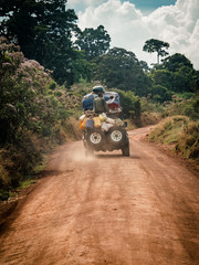 jeep 4wd fully loaded on dirt track in africa central perspective