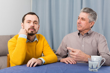Mature father and son serious talk