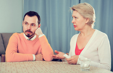 Mature mother and son quarrel
