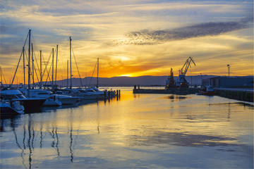 Marina and commercial harbor at sunset