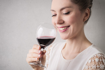 Pretty woman drinking wine