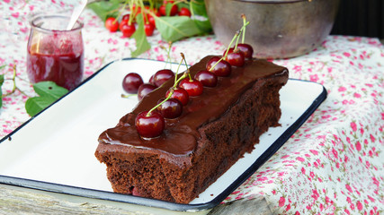 Chocolate cake with cherries and dark chocolate icing