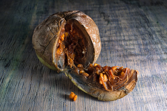cut borojo fully ripe fruit closeup on wood surface