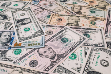 Pile of new and old one hundred dollar bills bills.