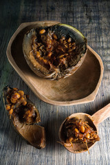 cut up borojo fruit, considered a superfood,  on rustic wood background