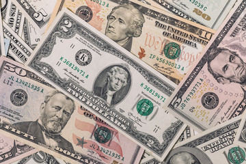 Pile of new and old one hundred dollar bills bills.