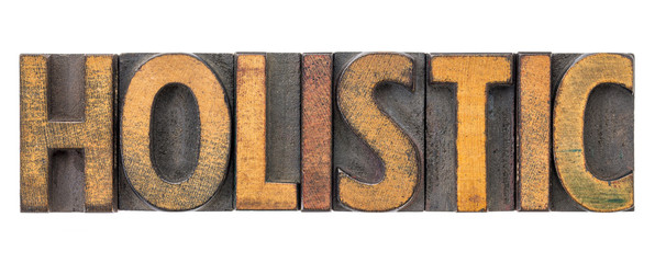 holistic - word abstract in wood type