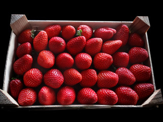 Strawberries aligned in a wood Box Healthy Food for sell