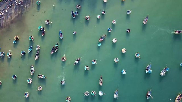 Top view. Aerial view fishing harbour market from drone. Royalty high quality free stock image of market at Mui Ne fishing harbour or fishing village. Fishing harbor is a popular tourist destination