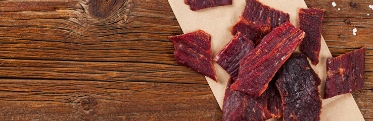 Delicious Homemade Beef Jerky Background. Selective focus. - obrazy, fototapety, plakaty