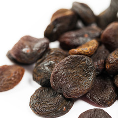 Organic Dried Apricots on White Background. Selective focus.