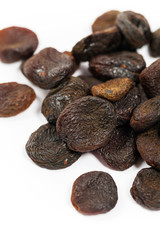 Organic Dried Apricots on White Background. Selective focus.