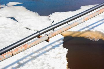 Industrial pipe over ice and water