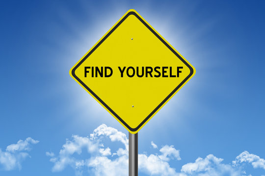 Find Yourself sign on blue sky background with sun and clouds and inspirational text