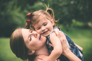 Mother holding daughter 