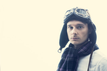 young man wearing flying cap.