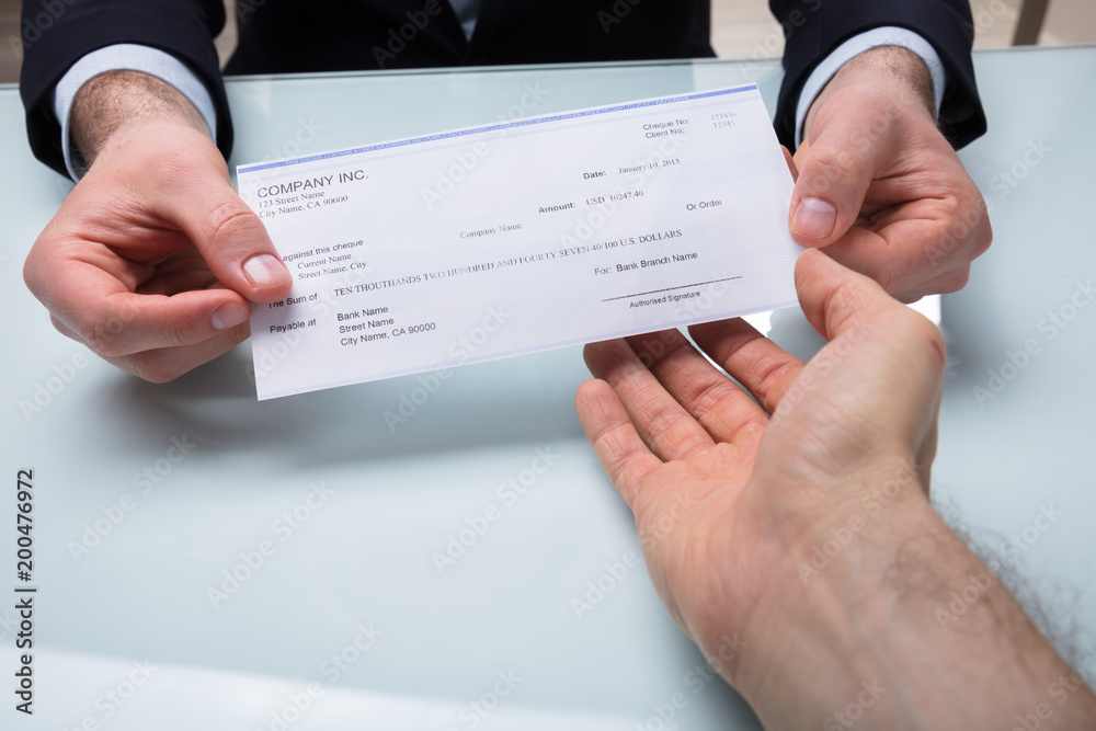 Wall mural Businessman Giving Cheque To His Colleague